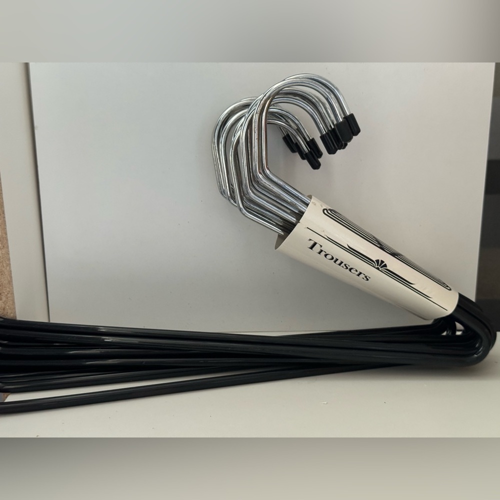 20 piece set of pants hangers in black only.